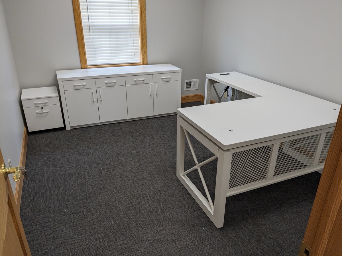 White L-shaped desk with storage